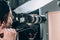Focus of videographer filming beautiful woman in photo studio