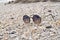 Focus view sunglasses on sand beach