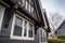 focus on weathered wood trims on prominent front tudor gable