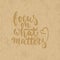 Focus on what matters - hand drawn lettering phrase isolated on the cardboard grunge background. Fun brush ink