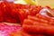 Focus on a wooden board sliced salami and cabanos sticks. Shallow depth of field. Wine appetizer