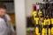 Focus on yellow screwdrivers hanging on one shelf in a tool and equipment shop for craftsmen. Copy Space