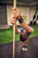 Focus on your form as well. Full length shot of a handsome young man working out with a stick in the gym.