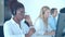 Focused African American call center operator putting on headset