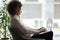 Focused african American woman work on laptop in office