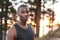 Focused African man standing on a trail while out jogging