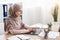 Focused arabic businesswoman in hijab working on laptop computer in office