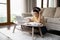 Focused Black female student in headphones engaged in studying