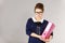 Focused business woman holding binder with documents