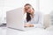 Focused businesswoman using laptop at desk