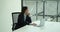 Focused Businesswoman Using Laptop at Work Desk