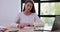 Focused businesswoman writing note at desk in office