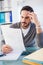 Focused casual businessman working at his desk