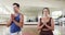 Focused caucasian male instructor and female student practicing yoga meditation in gym, slow motion