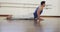 Focused caucasian man practicing yoga in gym, slow motion