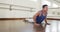 Focused caucasian man practicing yoga in gym, slow motion
