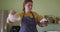 Focused caucasian woman baking in kitchen