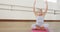 Focused caucasian woman practicing yoga in gym, slow motion