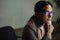 Focused charming woman wearing eyeglasses working in office