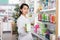 Focused Chinese pharmacist is searching medicines