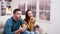 Focused couple sitting on couch watching tv