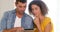 Focused couple using tablet