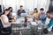 Focused creative business team working around glass table