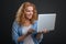 Focused dedicated woman typing a letter