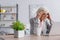 Focused elderly woman looking at laptop