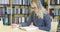 Focused female student studying in the school library