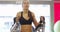 Focused fitness woman workout her abs in fitness gym