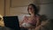 Focused freelancer working bed searching idea closeup. Late girl typing laptop