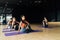 Focused group of athletes practicing yoga in fitness club