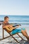 Focused handsome man strumming guitar