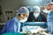 Focused on an intricate surgical procedure. surgeons in an operating room.