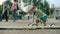 Focused kid making first try on bike. Cute boy riding bike in amusement park