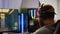 Focused man gamer putting headset playing shooter online video game