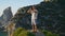 Focused man practicing yoga at beautiful ocean cliff morning. Yogi relax breathe