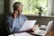 Focused mature man reading financial document or received paper