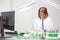 Focused middle age woman taking notes after scientific test in a production laboratory