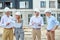 Focused middle-aged female inspector inspecting building plans