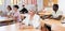 Focused motivated older woman listening to lecture in classroom