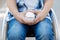 Focused photo of male hands while holding ball