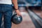 Focused photo. Rear particle view of man in casual clothes playing bowling in the club