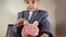 Focused preschool child, boy in suit counting the coins. Investment concept and child savings