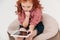 focused redhead little child sitting and using digital tablet