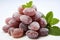 focused shot of dried plums with white background