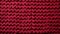 focused shot of red knitted texture background