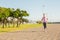 Focused sporty blonde jogging at promenade