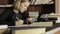 Focused student studying in the library in college. Female student sitting at the desk and doing homework